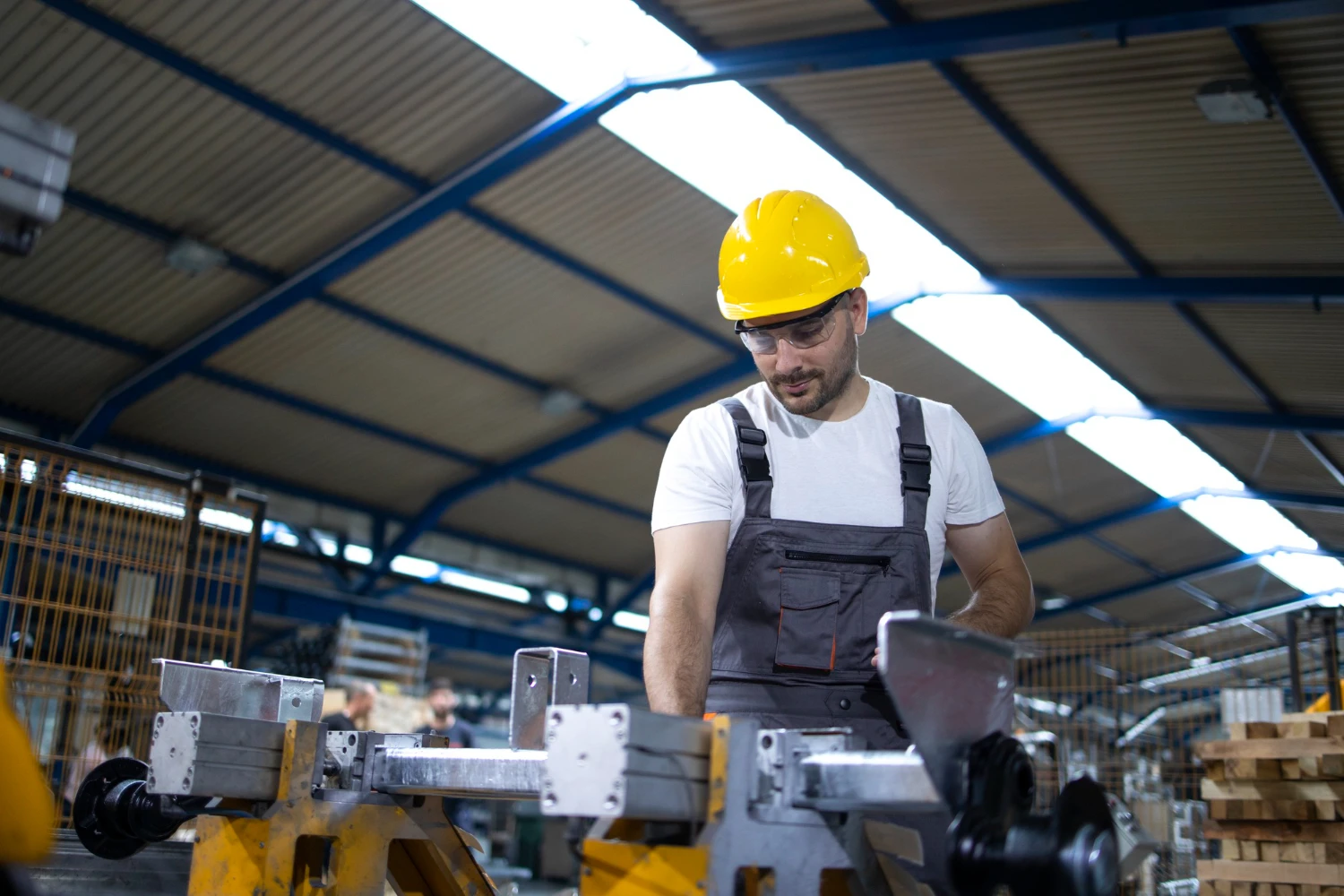 Industrial manufacturing facility generating byproducts for critical mineral recovery